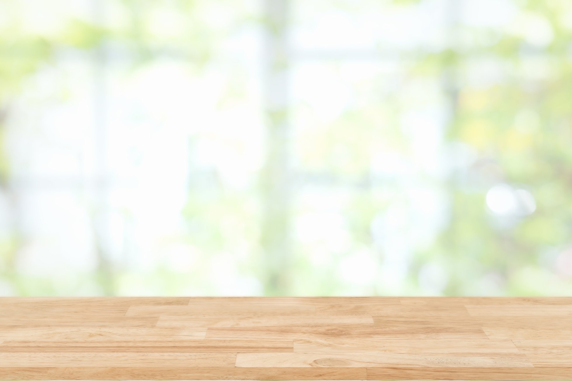 Empty Brown Wooden Table With a Window as the Background